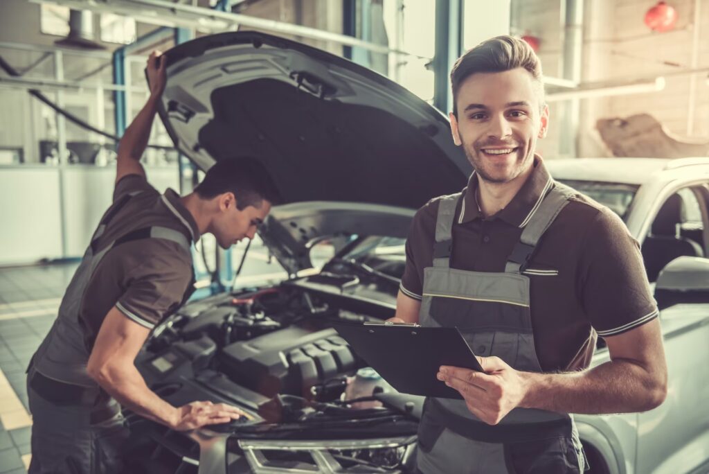egular car servicing in Brisbane — mechanic checking brakes at a local workshop